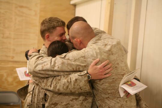Marines with Motor Transportation Company, Combat Logistics Battalion 5, 1st Marine Logistics Group, remember a fellow Marine who died in a combat zone while serving here. A memorial service was held Dec. 27 here for Lance Cpl. Robert L. Johnson, 21, a MT operator from Central Point, Ore.