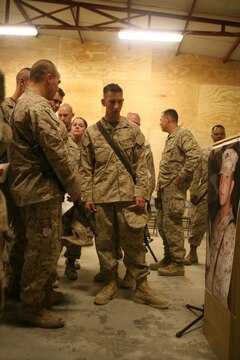 Marines with Motor Transportation Company, Combat Logistics Battalion 5, 1st Marine Logistics Group, remember a fellow Marine who died in a combat zone while serving here. A memorial service was held Dec. 27 here for Lance Cpl. Robert L. Johnson, 21, a MT operator from Central Point, Ore.