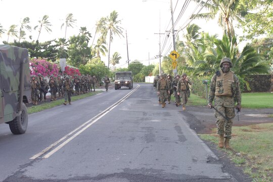 Marines from Lima Company, 3rd Battalion, 3rd Marine Regiment, hike from Marine Corps Training Area, Bellows, back to K-Bay, on the morning of Sept. 15.  This was the first hike for Lima Company that took place off base.