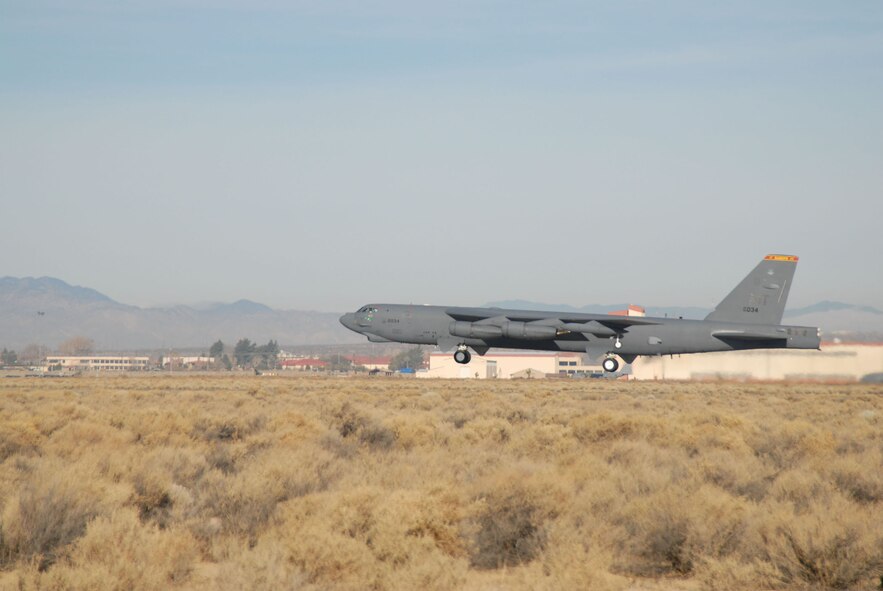 A B-52 Stratofortress takes off from Edwards Air Force Base, Calif., Dec. 15 during a flight-test mission using a blend of synthetic fuel and JP-8 in all eight engines.  This is the first time a B-52 has flown using a synfuel-blend as the only fuel on board.  In September, the Air Force successfully flew a B-52 with two-engines using the synfuel-blend while the others used standard fuel. The B-52 test flights at Edwards are the initial steps in the Air Force process to test and certify a synthetic blend of fuel for its aviation fleet. (U.S. Air Force photo/Tech. Sgt. Eric M. Grill)