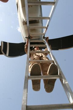 Sgt. James C. Curtis checks an engine during a preflight inspection of a KC-130J Hercules at Al Asad, Iraq, March 17. Curtis and other enlisted crewmembers with Marine Aerial Refueler Transport Squadrons 352, Marine Aircraft Group 16 (Reinforced), 3rd Marine Aircraft Wing, are responsible for safely conducting Marine aerial refueling missions throughout Iraq. Curtis is a crew chief and Olympia, Wash., native.