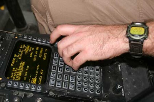 A Marine uses a cockpit instrument panel to conduct a preflight inspection of a KC-130J Hercules flight and aerial refueling systems at Al Asad, Iraq, March 17.