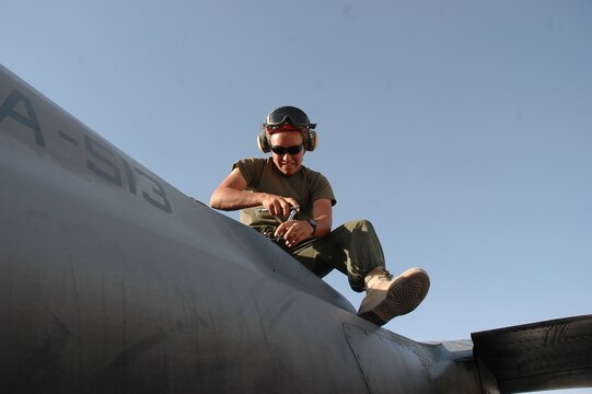 Lance Cpl. Nicholas M. Aguilar uninstalls the flares dispenser from an AV-8B Harrier on the flight line at Al Asad, Iraq, July 10. The flare dispenser provides aircraft defensive countermeasures against surface-to-air missiles. Aguilar, an ordnance technician with Marine Attack Squadron 513, Marine Aircraft Group 16 (Reinforced), 3rd Marine Air Wing, and the rest of the ordnance shop, is responsible for ensuring that all Harriers leaving the air station are equipped with the necessary munitions.