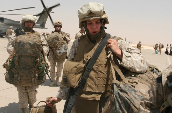 Sgt. Alice Dunne stages her bags on the flight line at Al Asad, Iraq, July 31, before flying to Camp Korean Village, Iraq, to train with 3rd Light Armored Reconnaissance Battalion, and begin her 30-day security cycle in the Lioness Program. Eight female Marines from different units within 3rd Marine Aircraft Wing volunteered for the Lioness Program to conduct security searches of women crossing into Iraq. Dunne is an electrical equipment repair specialist, Marine Tactical Air Command Squadron 38, Marine Air Control Group 38 (Reinforced), 3rd MAW, and an Oxford, Wis., native.