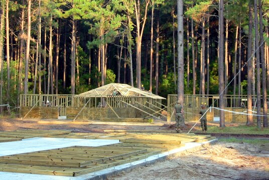 Lance Cpl. Hollye K. Meeks (left) searches Cpl. Roxanne Cox, after receiving a class on the proper procedures from members of a police transition team. Eight female Marines from different units within 3rd Marine Aircraft Wing volunteered for the Lioness Program to conduct security searches of women crossing into Iraq. Meeks is a motor transport vehicle operator, Marine Wing Support Squadron 374, Marine Wing Support Group 37 (Reinforced), 3rd MAW, and a Houston, Texas native. Cox is a maintenance management specialist, with Marine Aircraft Group 16 (Reinforced), 3rd MAW, and a Cincinnati native.