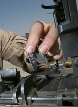 A Marine crew chief checks the timing and spacing on an M2 .50-caliber machine gun on a UH-1N Huey before a dismounted patrol escort flight May 11. Ahlers is a crew chief and Jefferson, Wis., native deployed with Marine Light Attack Helicopter Squadron 169, Marine Aircraft Group 16 (Reinforced), 3rd Marine Aircraft Wing.