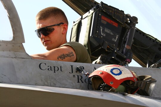 Lance Cpl. Robert Simpson conducts a weapon systems check in a Thunderbolt F/A-18C Hornet cockpit at Al Asad, Iraq, Sept. 19. System checks are done before each launch to ensure ordnance will drop properly when needed. Simpson is an aircraft ordnance technician with Marine Fighter Attack Squadron 251, Carrier Air Wing One, Carrier Strike Group Twelve. Simpson is a native of Woodsville, N.H.
