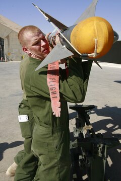 Lance Cpl. Daniel Johnson loads ordnance on a Thunderbolt F/A-18C Hornet at Al Asad, Iraq, Sept. 19. Johnson is an aircraft ordnance technician with Marine Fighter Attack Squadron 251, Carrier Air Wing One, Carrier Strike Group Twelve. Simpson is a native of Woodsville, N.H., Johnson hails from Beaufort, S.C., and Jacob calls Pittsburgh home.