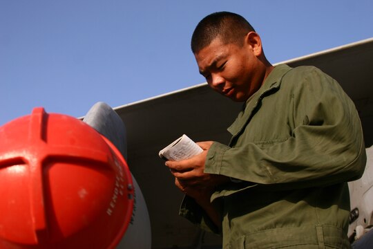 Lance Cpl. Daniel Kwak records the serial number of the loaded ordnance before the aircraft's launch at Al Asad, Iraq, Sept. 21. Serial numbers on the ordnance help keep track of ordnance expended during missions. Kwak is an aircraft ordnance technician with Marine Fighter Attack Squadron 251, Carrier Air Wing One, Carrier Strike Group Twelve. Kwak is a native of Tamuning, Guam.