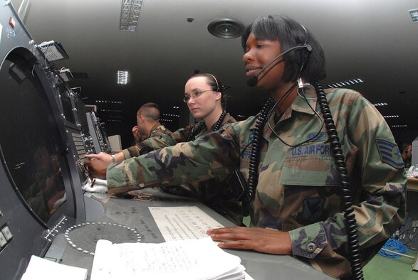 Staff Sgt. Crystal Sheffield (right) and Airman 1st Class Amber Hoedebeck, 623rd Air Control Flight weapons directors, control a mission by using a Base Air Defense Ground Environment system at Naha Air Base, Japan. Kadena Air Base's 623rd ACF is in charge of commanding and controlling 85 percent of local F-15 daily training as well as real-world operations, providing overlapping command and control support with AWACS aircraft and providing primary support when AWACS is not available. (U.S. Air Force photo/Staff Sgt. Steven Nabor)