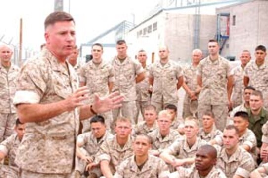 Maj. Gen. Terry G. Robling, 3rd Marine Aircraft Wing commanding general, congratulates the Marines of Marine Attack Squadron 311 for receiving a Chief of Naval Operations Aviation Safety Award Sept. 20 here outside the VMA-311 hangar. Robling, who assumed command of the MAW in July, was visiting the Marine Aircraft Group 13?s aircraft and support squadrons to familiarize himself with the Marines he leads.