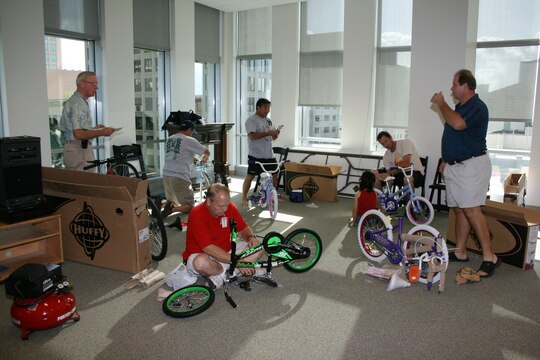 BAE Systems employees assemble 100 "Bikes for Tykes" for the Marine Corps Reserve's Toys for Tots annual drive Saturday, Nov 17, 2007 at the First Hawaiian Bank Center, Honolulu.  BAE Systems employees donated the money to purchase the bicycles, and donated their time to assemble them.  All the toys donated in Hawaii stay in Hawaii to benefit less fortunate keiki.