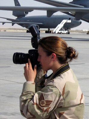 Staff Sgt. Ericka Khudakivsky, from the U.S. Air Force Expeditionary Center at Fort Dix, N.J., takes photo on the flightline of her deployed base while working June 22 in Southwest Asia.  During her deployment from May to September 2007, Sergeant Khudakivsky took more than 8,000 photos documenting the Air Force wartime mission for the Global War on Terrorism.  (U.S. Air Force Photo)