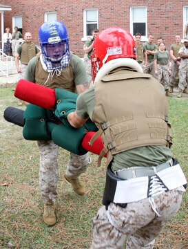 One shot, one kill: With perfect form and extreme intensity, Master Gunnery Sgt. Timothy G. Haddix dodges his opponent?s guard and strikes him with a killing thrust to the torso, giving him the win.