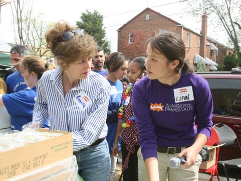 Annette Conway (left), along with Lian Mah," KaBoom! "project manager, organizes lunch for volunteers during a playground construction event in Washington, D.C., April 11. Marines from Marine Barracks Washington provided about half of the build captains for the event, said Tracy Monson, marketing and special events director of "So Others Might Eat," a charity organization involved with the event.
