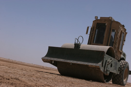 Heavy equipment operators with Marine Wing Support Squadron 172, 3rd Marine Aircraft Wing (Forward), use several different assets to level the area and compact dirt when constructing helicopter-landing zones. The squadron constructs and maintains HLZs at various locations in Iraq. Leveling the ground is a key step in the process.