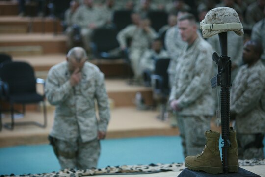 CAMP FALLUJAH, Iraq (August 16, 2008) - Marines with Maintenance Company, Combat Logistics Battalion 1, 1st Marine Logistics Group, came to pay their final respects to Cpls. Adam T. McKiski and Stewart S. Trejo during a memorial service Aug. 16. The Sergeant Major of the Marine Corps, Sgt. Maj. Carlton W. Kent, and Commanding General of 1st Marine Logistics Group, Brig. Gen. Robert R. Ruark were in attendance along with service members who knew the Marines. (Photo by Cpl. Tyler B. Barstow)