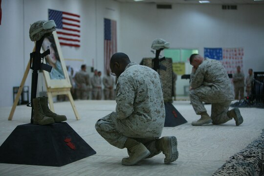 CAMP FALLUJAH, Iraq (August 16, 2008) - Marines with Maintenance Company, Combat Logistics Battalion 1, 1st Marine Logistics Group, came to pay their final respects to Cpls. Adam T. McKiski and Stewart S. Trejo during a memorial service Aug. 16. (Photo by Cpl. Tyler B. Barstow)