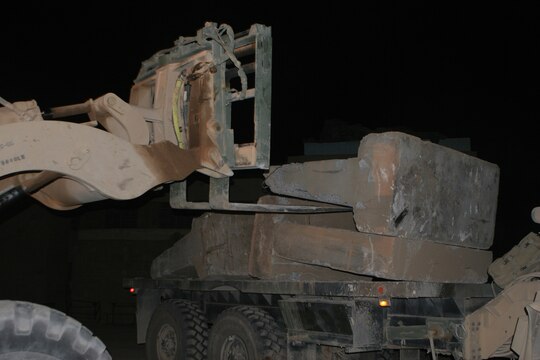 RAMADI, Iraq (August 29, 2008) – Marines with Combat Logistics Company 51, Combat Logistics Battalion 5, 1st Marine Logistics Group, use a Tractor, Rubber tired, Articulate steering, Multi-purpose vehicle to pick up “Texas” barriers at Combat Outpost Jumayiah so they can be transported to al-Sora. Service members worked from the COPs to provide additional safety and support for the Iraqi people. The platoon sized bases were being demilitarized and consolidated with the larger bases outside the cities in order to transfer security of al-Anbar Province to the Iraqi Civilian Authority and the Iraqi Security Forces. (Photo by Lance Cpl. Jacob A. Singsank)