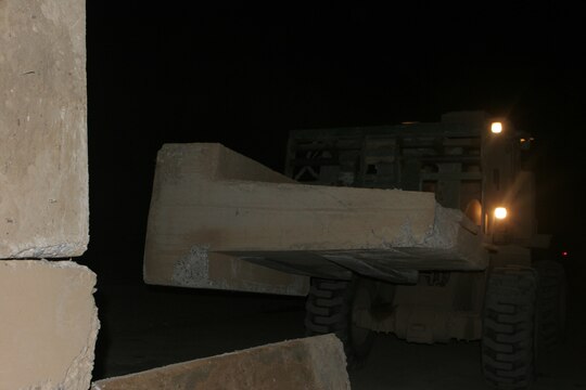RAMADI, Iraq (August 29, 2008) – Marines with Combat Logistics Company 51, Combat Logistics Battalion 5, 1st Marine Logistics Group, use a Tractor, Rubber tired, Articulate steering, Multi-purpose vehicle to pick up “Texas” barriers at Combat Outpost Jumayiah so they can be transported to al-Sora. Service members worked from the COPs to provide additional safety and support for the Iraqi people. The platoon sized bases were being demilitarized and consolidated with the larger bases outside the cities in order to transfer security of al-Anbar Province to the Iraqi Civilian Authority and the Iraqi Security Forces. (Photo by Lance Cpl. Jacob A. Singsank)