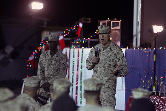 General James T. Conway, Commandant of the Marine Corps, speaks to Marines, Sailors and Soldiers during a ?town hall? meeting here Dec. 25. Conway and Sergeant Major Carlton W. Kent, Sergeant Major of the Marine Corps, talked about the growth of the Corps and the Corps? anticipated shift to Afghanistan.