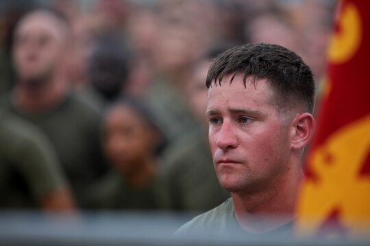 A Marine with Combat Logistics Regiment 17, 1st Marine Logistics Group, listens to his regimental commander talks after a regimental run aboard Camp Pendleton, Calif., Sept. 2. It was a chance for all personnel within the regiment to do something together as a unit, building unit camaraderie.