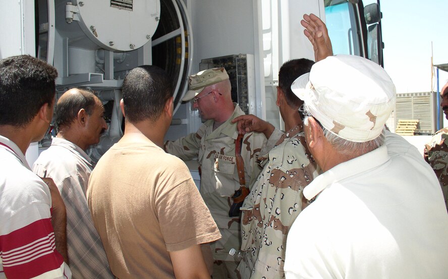 Tech. Sgt. Richard Oliver, from the U.S. Air Force Expeditionary Center's 421st Combat Training Squadron at Fort Dix, N.J., teaches Iraqis how to use one of their fuels trucks during his deployment to Taji Air Base, Iraq, in 2007.  (U.S. Air Force Photo)
