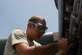 SOUTHWEST ASIA -- Senior Airman Anthony Boyd assigned to the 386th Expeditionary Maintenance Squadron, changes a fuel filter on a C-130 aircraft engine on July 26 at a base in Southwest Asia. Engine specialists play a significant part in the litany of maintenance checks and procedures accomplished during a home station check, which is being performed on numerous aircraft assigned to the squadron. Airman Boyd is deployed from Dyess Air Force Base, Texas. (U.S. Air Force photo/Staff Sgt. Jamie George)