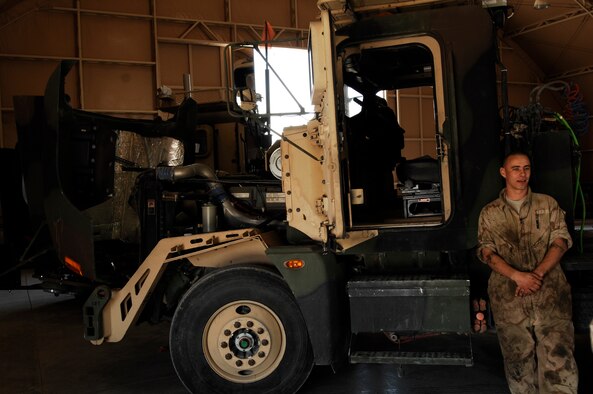 SOUTHWEST ASIA -- Staff Sgt. Tibor Pecsuk, a vehicle maintainer deployed to the 586th Expeditionary Logistics Readiness Squadron, 70th Medium Truck Detachment, takes a quick break during scheduled maintenance on a M915A3 tractor-trailer truck recently at an Army camp in the Persian Gulf Region. The Airmen of the 70th and 424th MTDs assigned to the 586th ELRS are in-lieu-of forces supporting the Army Support Line-Haul Convoy movements in and out of Iraq. Sergeant Pecsuk is deployed from the 437th Logistics Readiness Squadron, Charleston Air Force Base, S.C. (U.S. Air Force photo/ Staff Sgt. Patrick Dixon)