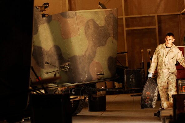SOUTHWEST ASIA -- Senior Airman Ryan Duncan, a vehicle maintainer deployed to the 586th Expeditionary Logistics Readiness Squadron, 70th Medium Truck Detachment, readies himself for an oil and filter change during scheduled maintenance on a M915A3 tractor-trailer truck recently at an Army camp in the Persian Gulf Region. The Airmen of the 70th and 424th MTDs assigned to the 586th ELRS are in-lieu-of forces supporting the Army Support Line-Haul Convoy movements in and out of Iraq. Airman Duncan is deployed from the 97th Logistics Readiness Squadron, Altus Air Force Base, Okla. (U.S. Air Force photo/ Staff Sgt. Patrick Dixon)