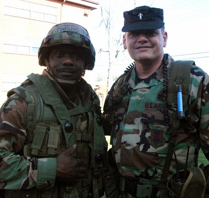 Chaplain (Maj.) Harold B. Owens, from the Ohio Air National Guard in Toledo, and Chaplain (Maj.) Thomas B. Porter, U.S. Air Force Expeditionary Center chaplain, stop for a photo during training in the Advanced Contingency Skills Course 08-4 April 15, 2008, at Fort Dix, N.J.  Both chaplains are graduates of Birmingham (Ala.) Southern College and chaplains in the Air Force.  They met up somewhat unexpectedly during the ACST while Chaplain Porter was teaching a class.  (U.S. Air Force Photo/Tech. Sgt. Scott T. Sturkol)