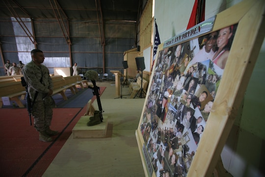 – A display of photos adorns the memorial for Lance Cpl. Stacy Ann Dryden, 22, from North Canton, Ohio, during her memorial service here, Oct. 27. Service members with 1st Maintenance Battalion (-) (Reinforced), 1st Marine Logistics Group, joined together to honor Dryden who was serving in Iraq as a preservation, packaging and packing specialist when she died, Oct. 19 from a non-combat related incident in al Anbar Province, Iraq.