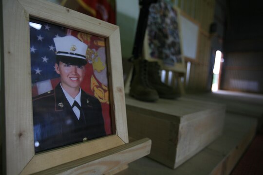 Service members with 1st Maintenance Battalion (-) (Reinforced), 1st Marine Logistics Group, joined together to honor one of their fallen Marines during a memorial service here, Oct. 27. Lance Cpl. Stacy Ann Dryden, 22, from North Canton, Ohio, was serving in Iraq as a preservation, packaging and packing specialist when she died, Oct. 19 from a non-combat related incident in al Anbar Province, Iraq.
