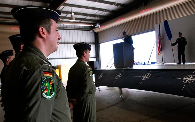 German air force Col. Axel Pohlmann, 80th Operations Group commander, and members of the 459th Flying Training Squadron welcome the new squadron and commander during the 459th FTS reactivation ceremony April 17. The squadron was reactivated to alleviate congestion in the 89th FTS. (U.S. Air Force photo/Harry Tonemah)