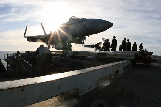 An F/A-18 "Hornet" belonging to Marine Attack Training Squadron 101, Marine Aircraft Group 11, 3rd Marine Aircraft Wing, I Marine Expeditionary Force,  sits on the flight deck of the USS John C. Stennis after being used to conduct carrier qualification training by the fleet replacement pilots, Dec. 10. The pilots trained day and night to complete course requirements.  (Official U.S. Marine Corps photo by Cpl. Christopher O'Quin)(Released)