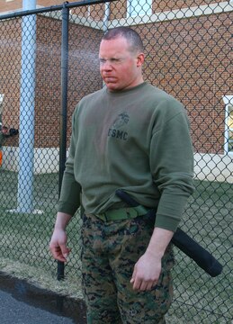 Cpl. Tyler Toliver, Marine guard, is sprayed with a potent chemical spray during an OC spray instructor qualification course at Marine Barracks Washington, July 17. The chemical, oleoresin capsicum, produces a burning sensation and many adverse effects when applied to the skin.