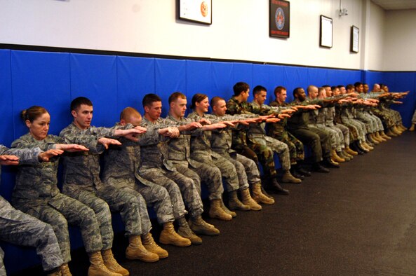 Students in the Air Force Phoenix Raven Training Course participate in a physical training session on Feb. 19, 2009, in the U.S. Air Force Expeditionary Center on Fort Dix, N.J.  The Raven course, taught by the USAF EC's 421st Combat Training Squadron, teaches security forces Airmen specialized training in aircraft security, combatives and verbal judo to name a few.  (U.S. Air Force Photo/Tech. Sgt. Scott T. Sturkol)