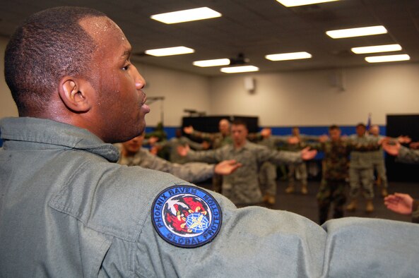 Tech. Sgt. Rudolph Stuart, instructor in the Air Force Phoenix Raven Training Course, talks to students on Feb. 19 during a training session in the U.S. Air Force Expeditionary Center on Fort Dix, N.J.  The Raven course, taught by the USAF EC's 421st Combat Training Squadron, teaches security forces Airmen specialized training in aircraft security, combatives and verbal judo to name a few.  (U.S. Air Force Photo/Tech. Sgt. Scott T. Sturkol)