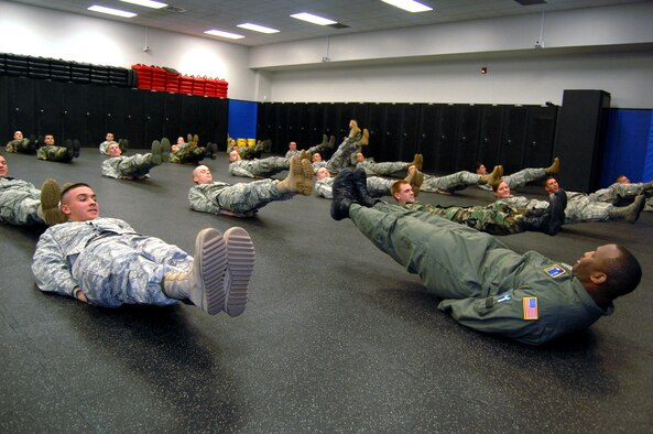 Tech. Sgt. Rudolph Stuart (right), instructor in the Air Force Phoenix Raven Training Course, talks to students on Feb. 19 during a training session in the U.S. Air Force Expeditionary Center on Fort Dix, N.J.  The Raven course, taught by the USAF EC's 421st Combat Training Squadron, teaches security forces Airmen specialized training in aircraft security, combatives and verbal judo to name a few.  (U.S. Air Force Photo/Tech. Sgt. Scott T. Sturkol)