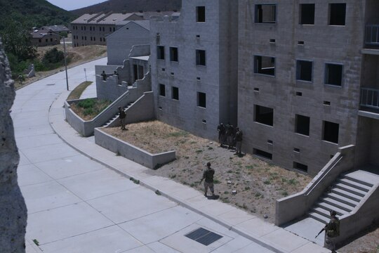 A team of Marines patrols part of the Combat Town in Camp Pendleton during the Warrior Day Challenge. The Marines participated in five scenarios during the all-day event, each one becoming more difficult. The Marines were tested on their teamwork and leadership skills.