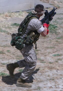 Marine makes a run for an empty building during the Warrior Day Challenge at the Combat Town in Camp Pendleton. The Marines participated in five scenarios during the all-day event, each one becoming more difficult. The Marines were tested on their teamwork and leadership skills.