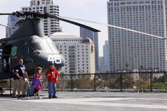 Nine-year-old Jethro Y. Yazzie from Arizona and Nine-year-old Hannah M. Reed from South Carolina, tour San Diego’s USS Midway Museum during the Tragedy Assistance Program for Survivors event, Oct. 10.