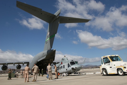 Marines with Marine Light Attack Helicopter Squadron 367, Marine Aircraft Group 39, 3rd Marine Aircraft Wing, I Marine Expeditionary Force, load a UH-1Y "Venom" onto a C-17 "Globemaster" III for transport to Afghanistan aboard the flight line here, Oct. 20. The squadron will deploy in support of Operation Enduring Freedom providing close-air support, casualty evacuation and performing many other types of missions.  (Official U.S. Marine Corps photo by Cpl. Christopher O'Quin)(Released)