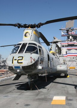 Marine Medium Helicopter Squadron 165, Marine Aircraft Group 16, 3rd Marine Aircraft Wing, I Marine Expeditionary Force, provided a CH-46E “Sea Knight” and pilots to answer questions about the aircraft aboard the USS Makin Island (LHD-8) during its commissioning ceremony, here Oct. 24.::r::::n::Pilots from Marine Light Attack Helicopter Squadron 267 joined HMM-165 in providing static displays with an UH-1N “Huey” and an AH-1W “Super Cobra” on the flight deck of the amphibious assault ship.