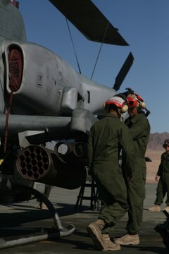 An AH-1 "Cobra" with Marine Light Attack Helicopter Squadron 469, Marine Aircraft Group 39, 3rd Marine Aircraft Wing, I Marine Expeditionary Force, gets prepared for the final training exercise during Exercise Steel Knight at Marine Corps Air Ground Combat Center Twentynine Palms.