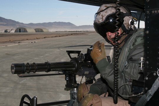 Gunnery Sgt. Brian Gunther, a crew chief with Marine Light Attack Helicopter Squadron 469, Marine Aircraft Group 39, 3rd Marine Aircraft Wing, I Marine Expeditionary Force, prepares weapons for the final training exercise during Exercise Steel Knight at Marine Corps Air Ground Combat Center Twentynine Palms Oct. 27.