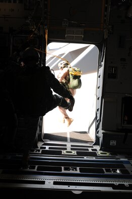 Tech. Sgt. John Gaona, jumpmaster during Cope India, executes a static jump out of a C-17 Globemaster III, Oct. 23. Cope India is a United States and India airlift exercise that provides training for humanitarian assistance and disaster relief operations. (U.S. Air Force photo/ Capt. Genieve David) 
