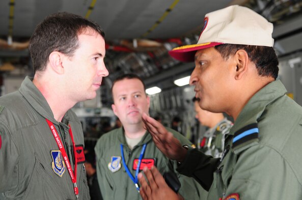 Commodore Shouvik Roy, commanding officer of Air Force Station Arga, asks questions of Maj. Sean Papworth, 535th Airlift Squadron, Hickam Air Force Base, Hawaii, during pre-flight discussion of the mission Oct. 22. Commodore Roy was an observer during one of the last sorties for Cope India. Cope India is a United States and India airlift exercise that provides training for humanitarian assistance and disaster relief operations. (U.S. Air Force photo/ Capt. Genieve David) 
