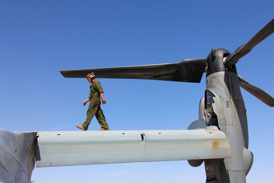 Lance Cpl. Mark Moretz, a flightline mechanic with Marine Medium Tiltrotor Squadron 261, 3rd Marine Aircraft Wing (Forward), takes a look at the wings and rotors of an MV-22 Osprey during a preflight inspection ensuring the bird is ready for a full day of missions April 24.