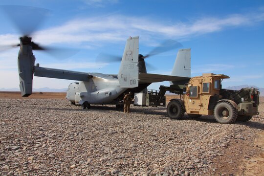 Marines load cargo on an MV-22 Osprey with Marine Medium Tiltrotor Squadron 261, 3rd Marine Aircraft Wing (Forward), April 24. The Osprey continues to prove a valuable asset for "shrinking the battle space" in 3rd MAW (FWD)'s operations area, flying faster and farther than any assault support aircraft in the region.